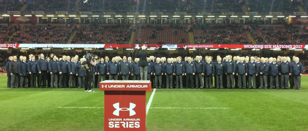 Combined Côr Meibion Morlais and Pendyrus Male Voice singing on the pitch ahead of the Wales -v- South Africa game.